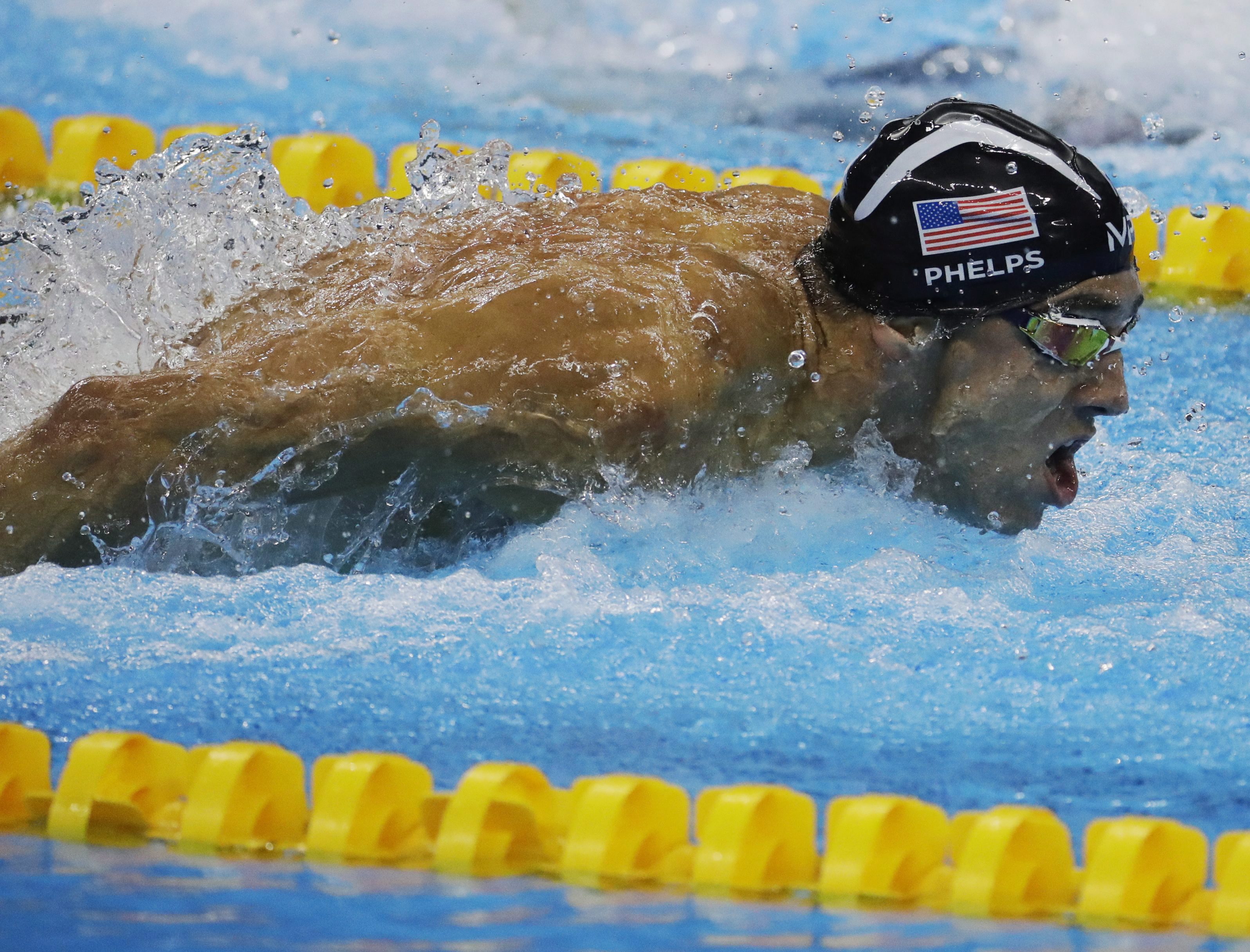 United States' Michael Phelps competes in the men's 4 x 100-meter medley relay final during the swimming competitions at the 2016 Summer Olympics, Saturday, Aug. 13, 2016, in Rio de Janeiro, Brazil. (AP Photo/Julio Cortez)