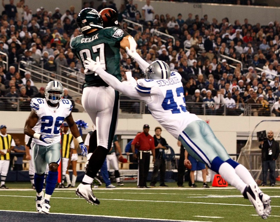 Philadelphia Eagles Brent Celek gets tackled by Dallas Cowboys Gerald Sensabaugh