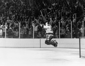 In this Feb. 22, 1980 file photo, U.S. Goalie Jim Craig leaps high in the air at the final second of game as the US Olympic hockey team won over the Soviet team 4-3 in Lake Placid. (AP Photo, File)
