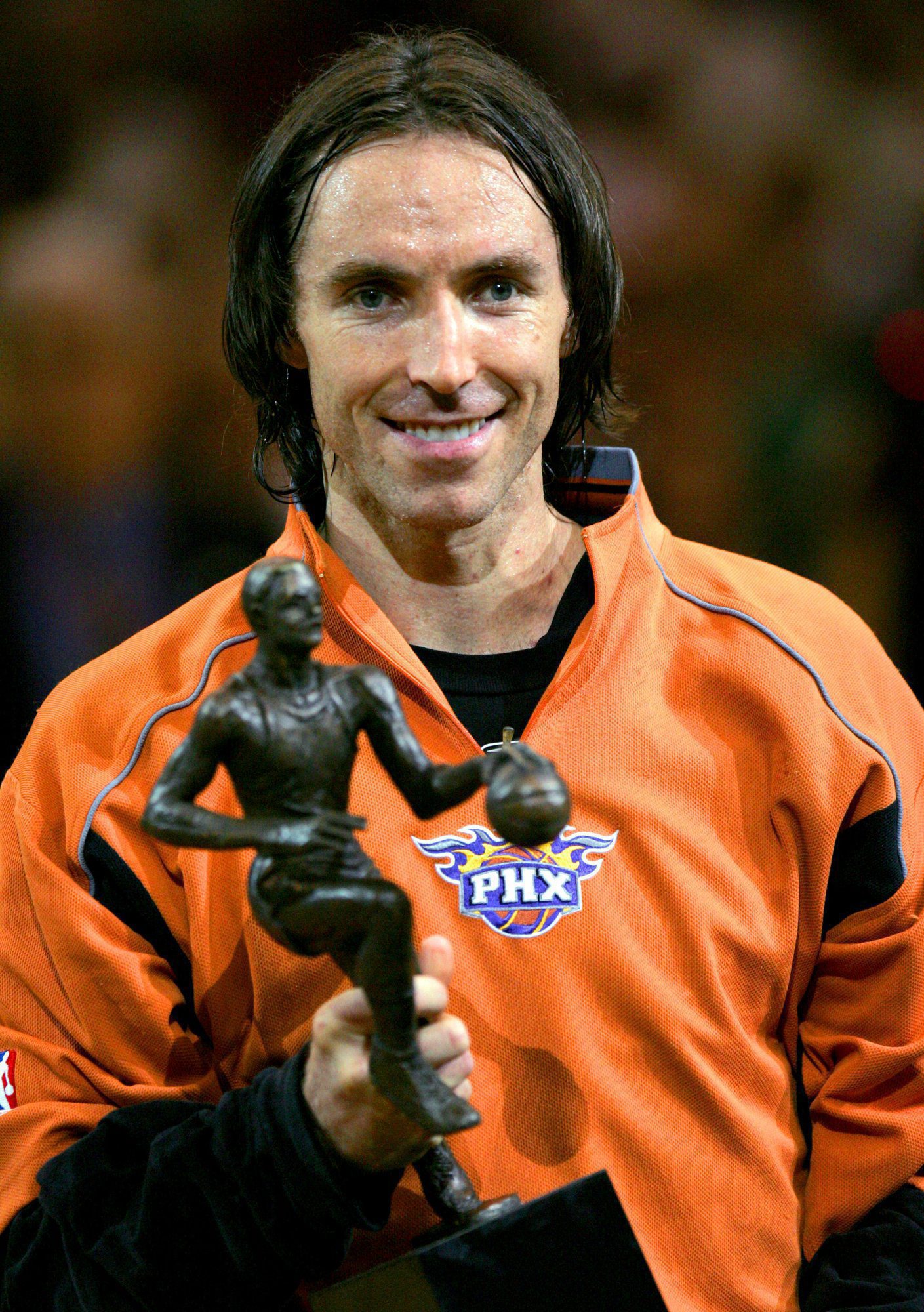 Phoenix Suns' Steve Nash of Canada holds his NBA MVP trophy prior to their Western Conference semifinals game against the Dallas Mavericks Monday, May 9, 2005, at America West Arena in Phoenix.(AP Photo/Matt York)
