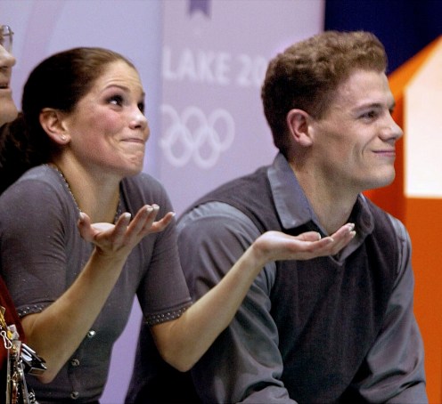 Canadian figure skaters Jamie Sale and David Pelletier react to their scores after competing in the pairs free program in the Olympic Winter Gamess at the Salt Lake Ice Center in Salt Lake City, Monday, Feb. 11, 2002. (AP Photo/Lionel Cironneau)