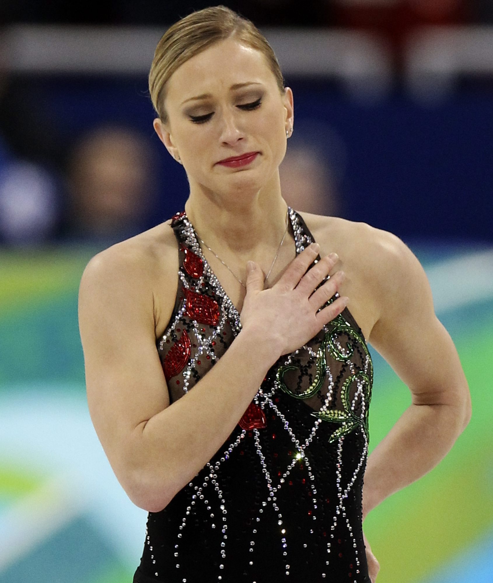 Joannie Rochette reacts with tears and a hand over her heart following her short program in Vancouver 2010