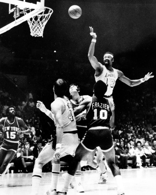 Wilt Chamberlain fires a leaping scoop shot against the New York Knicks in an NBA Finals basketball game in Los Angeles, 1972. (AP Photo/File)