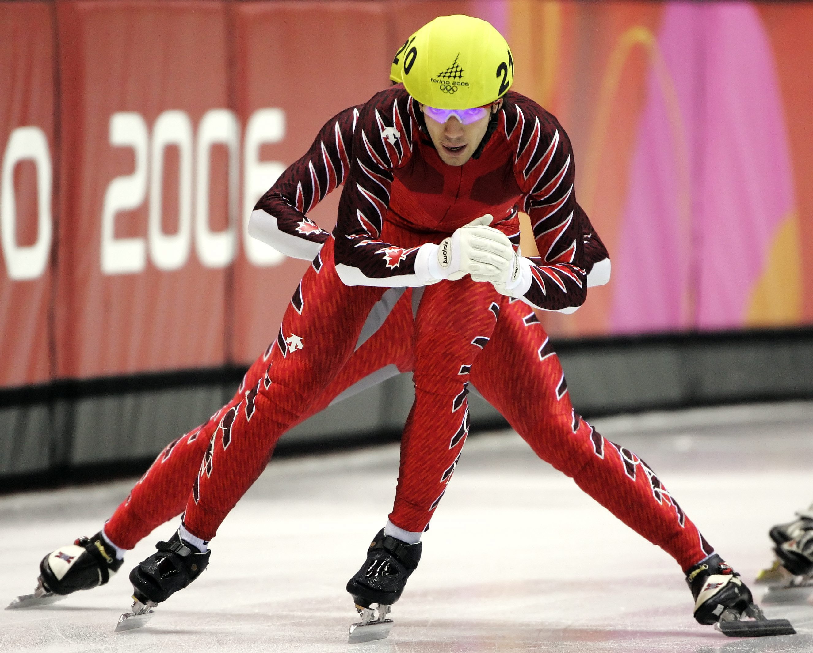 Canada's Charles Hamelin gets a push from his teammate Francois-Louis Tremblay during the men's 5000m relay semifinals at the Short Track Speed Skating race at the Turin 2006 Olympic Winter Games in Turin, Italy, Wednesday, Feb. 15, 2006. (AP Photo/Amy Sancetta)