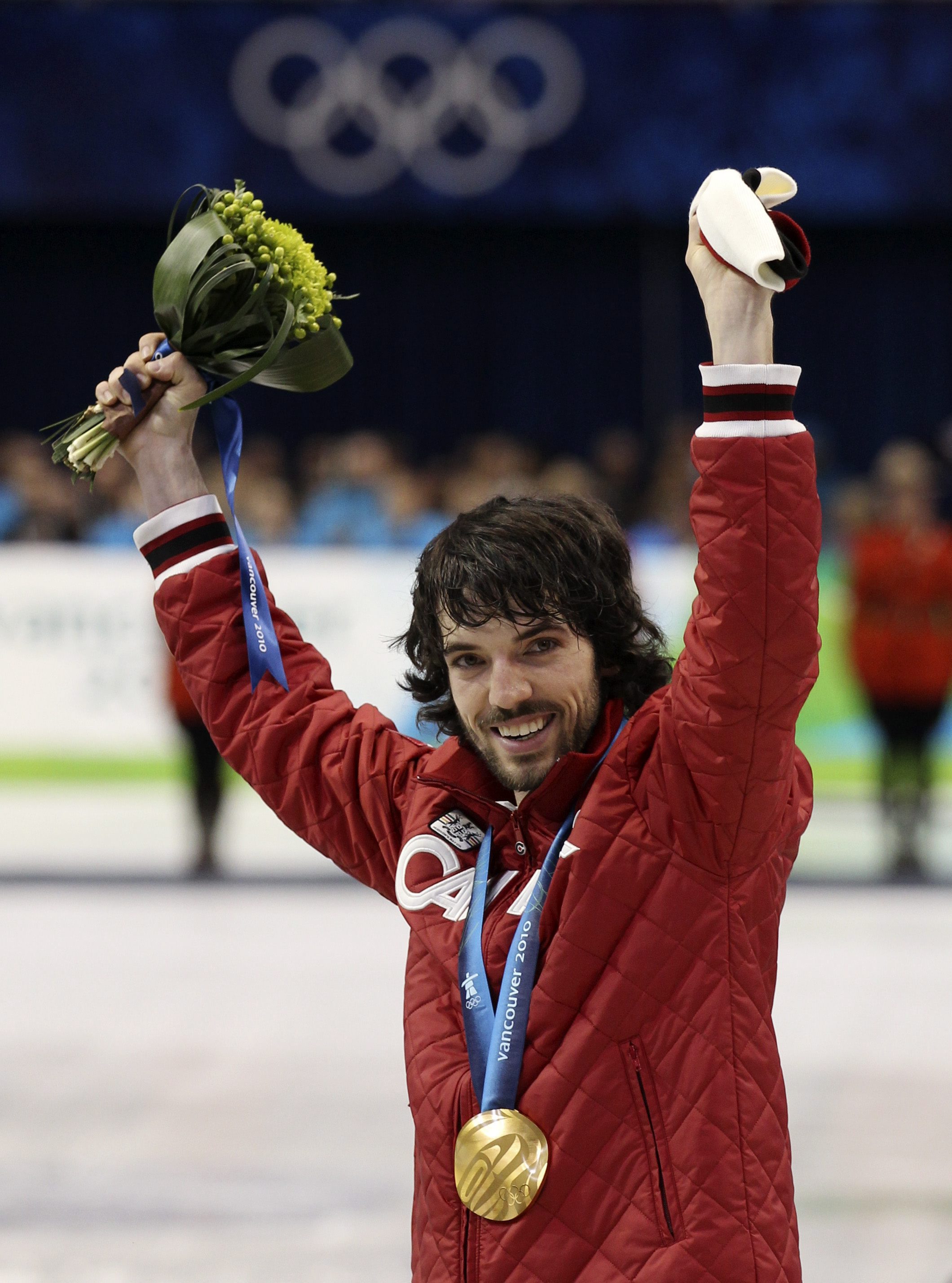 Canada's Charles Hamelin reacts on the podium after winning the gold medal for the men's 500m short track speed skating competition at the Vancouver 2010 Olympic Winter Games in Vancouver, British Columbia, Friday, Feb. 26, 2010. (AP Photo/Mark Baker)