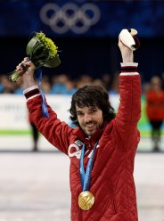 Canada's Charles Hamelin reacts on the podium after winning the gold medal for the men's 500m short track speed skating competition at the Vancouver 2010 Olympic Winter Games in Vancouver, British Columbia, Friday, Feb. 26, 2010. (AP Photo/Mark Baker)