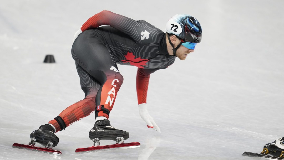 Pascal Dion skates in a short track speed skating race