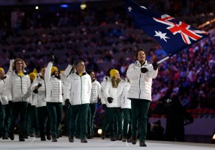 Alex Pullin of Australia carries the national flag as he leads the team during the opening ceremony of the 2014 Olympic Winter Games in Sochi, Russia, Friday, Feb. 7, 2014. (AP Photo/Patrick Semansky)
