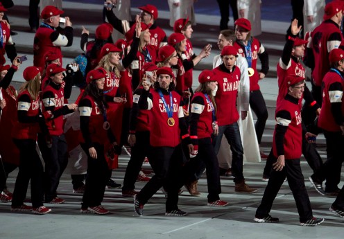 Members of the Canadian team enter the stadium for the closing ceremony for the Sochi 2014 Olympic Winter Games Sunday February 23, 2014 in Sochi, Russia. THE CANADIAN PRESS/Adrian Wyld