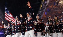 This Feb. 7, 2014 file photo shows the United States team arrives during the opening ceremony of the 2014 Olympic Winter Games in Sochi, Russia. Ralph Lauren's love for the American flag and American style earned him high honors Tuesday, June 17, from the Smithsonian Institution, celebrating his five decades in fashion. Lauren designed the uniforms for the US Winter Olympic team. (AP Photo/Patrick Semansky, File)