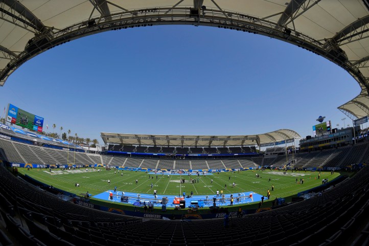 Players for the Seattle Seahawks and the Los Angeles Chargers walk on the field before a preseason NFL football game at the StubHub Center, Sunday, Aug. 13, 2017, in Carson, Calif. (AP Photo/Mark J. Terrill)