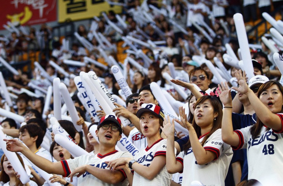 Team Canada - fans of the South Korean baseball team Doosan Bears sing songs while performing dance routines at Jamsil Stadium in Seoul, South Korea.
