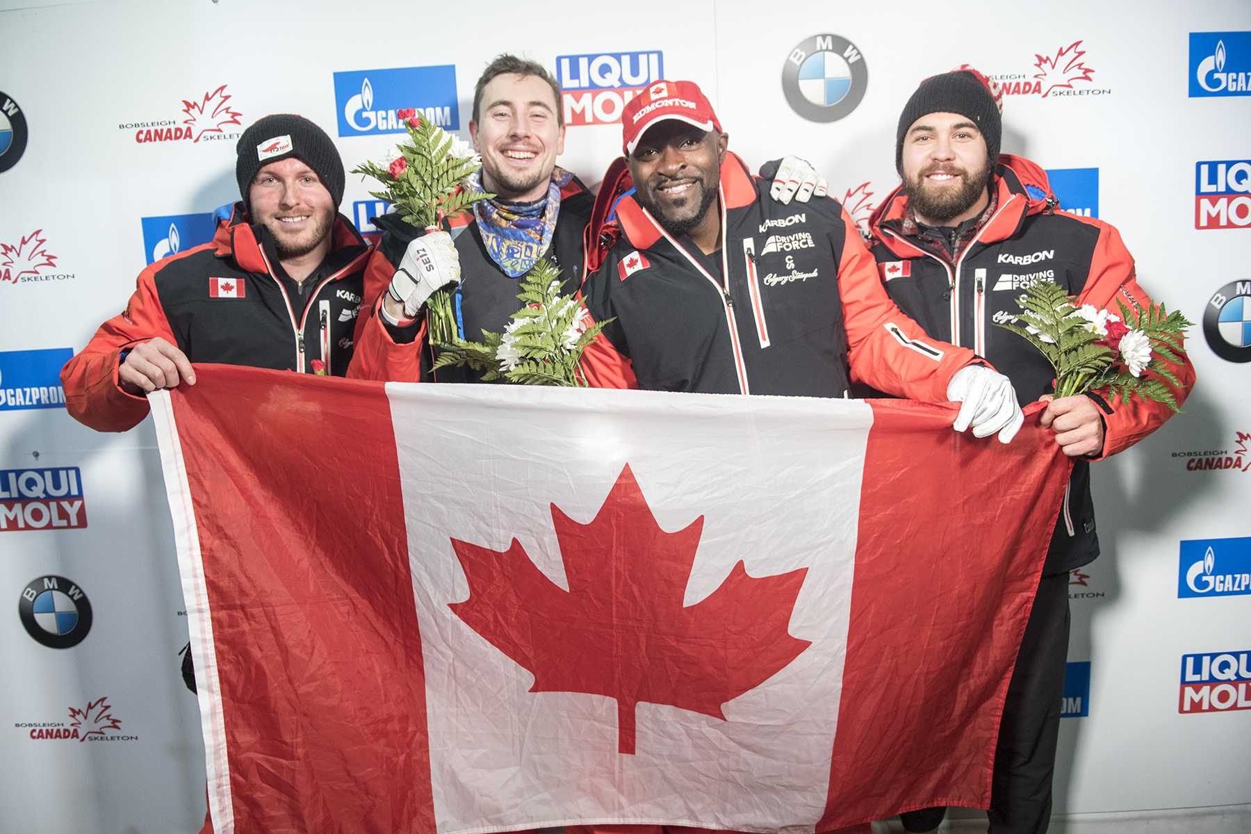 Team Canada - Justin Kripps, Alexander Kopacz, Neville Wright, and Chris Spring celebrate their 1-2 finish