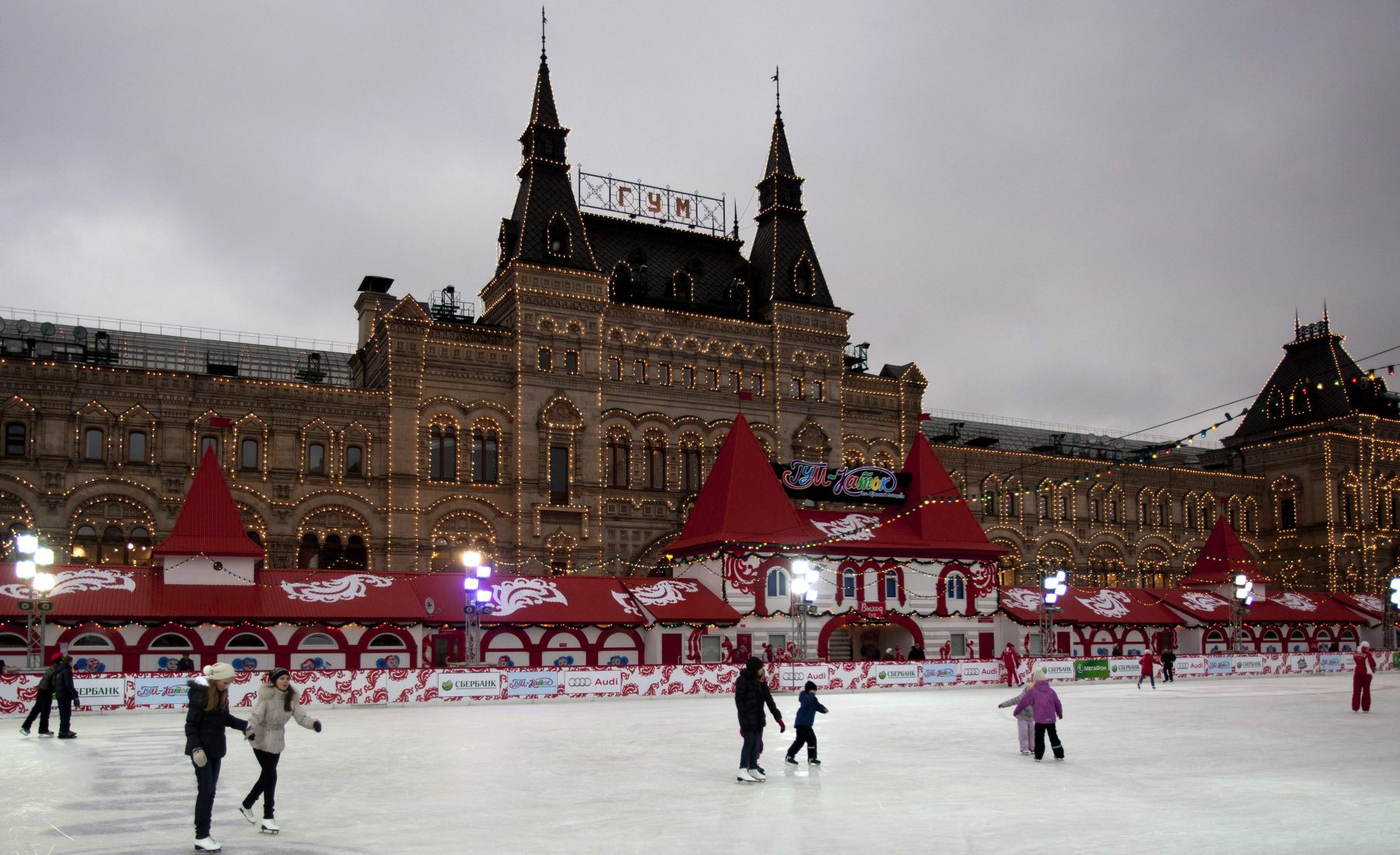 People skate on the ice rink opened on Red Square, with the building of the State Department Store in the background in Moscow, Russia, Saturday, Dec. 3, 2011. (AP Photo/Misha Japaridze)