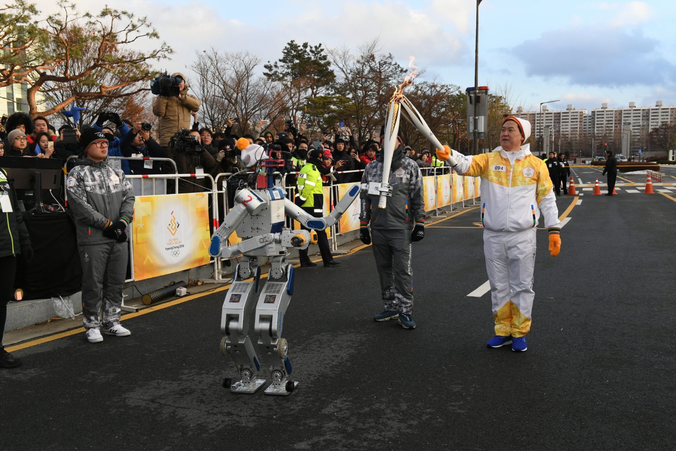 HUBO, a humanoid robot, carries the torch during the Pyeongchang 2018 Olympic torch relay