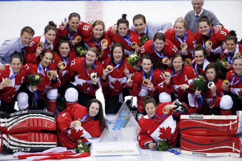 Team Canada members of Team Canada pose for a photo with their gold medals