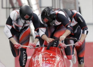 Pyeongchang Olympics Bobsled Driver Justin Kripps, Jesse Lumsden, Alexander Kopacz and Oluseyi Smith of Canada start their heat on the first day of four-man bobsled competition at the 2018 Winter Olympics in Pyeongchang, South Korea, Saturday, Feb. 24, 2018. (AP Photo/Wong Maye-E)