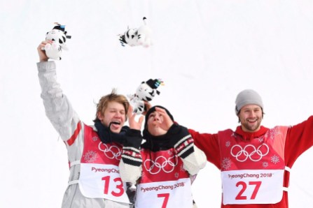 OLY SBD Big Air Canada 20180224 Gold medallist Sebastien Toutant of Canada, centre, silver medallist Kyle Mack of the United States, left, and bronze medallist Billy Morgan of Great Britain celebrate following the men's snowboard big air final at the 2018 Winter Olympic Games in Pyeongchang, South Korea, Saturday, Feb. 24, 2018. THE CANADIAN PRESS/Jonathan Hayward