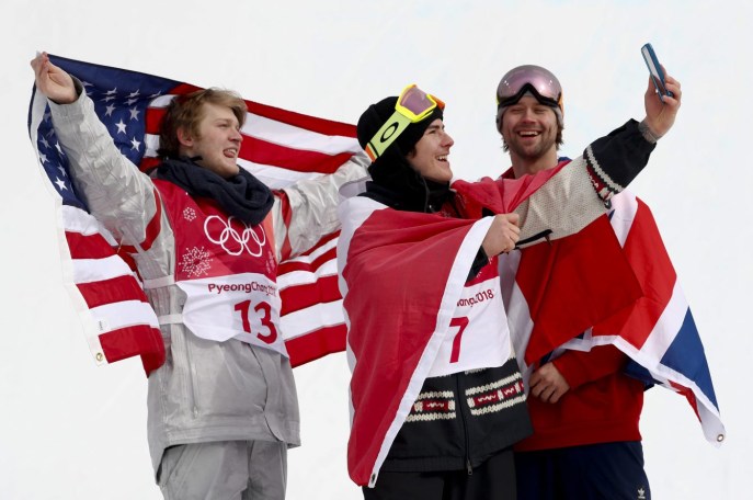 Pyeongchang Olympics Snowboard Men Gold medal winner Sebastien Toutant, of Canada, is flanked by silver medal winner Kyle Mack, of the United States, left, and bronze medal winner Billy Morgan, of Great Britain, during the venue ceremony for the men's Big Air snowboard competition at the 2018 Winter Olympics in Pyeongchang, South Korea, Saturday, Feb. 24, 2018. (AP Photo/Matthias Schrader)