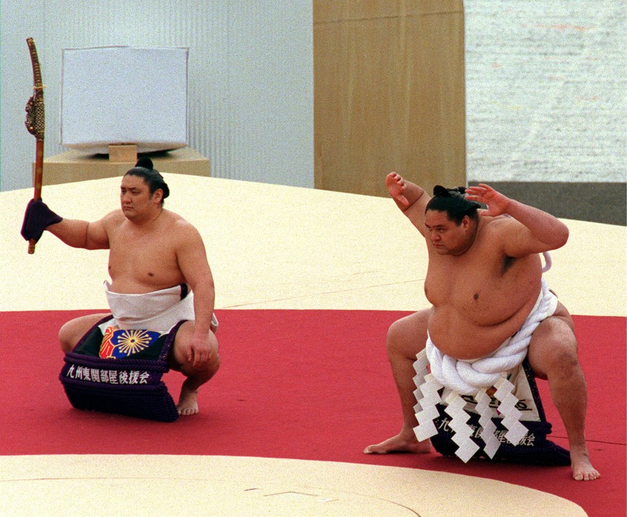 Sumo wrestlers perform a blessing