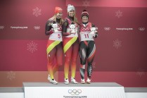 Team Canada's Alex Gough poses with Natalie Geinsenberger(L) and Dajan Eitberger(C) after winning Bronze