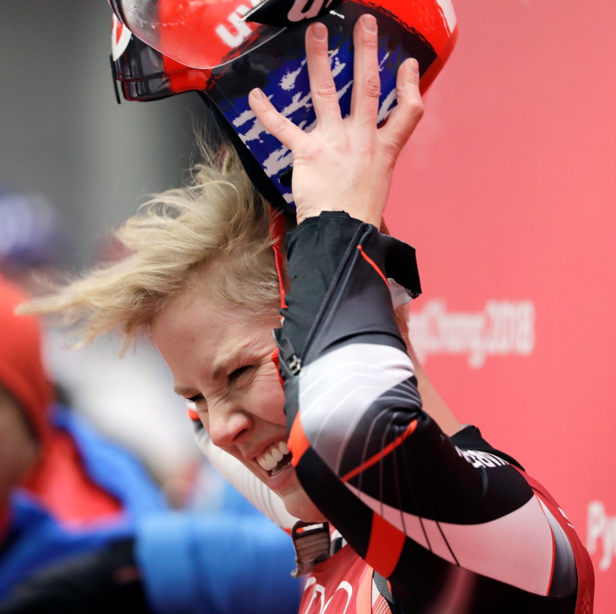 Alex taking off her helmet