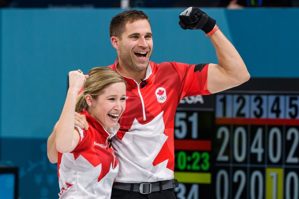 John Morris and Kaitlyn Lawes pump their fists in celebration