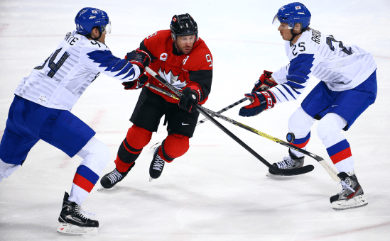 Team Canada South Korea Ice Hockey PyeongChang 2018 Team Canada's Derek Roy skates past two South Koreans in men's ice hockey action at PyeongChang 2018 on Feb. 18, 2018. (COC Photo/Vaughn Ridley)