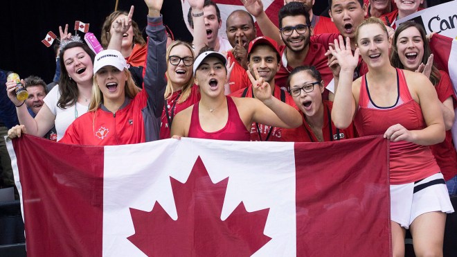 Genie Bouchard, Gaby Dabrowski and Bianca Andreescu celebrate after defeating Ukraine