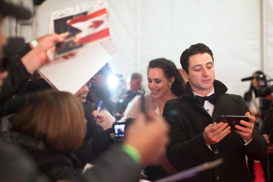 Tessa Virtue and Scott Moir sign autographs on the red carpet