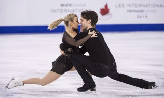 Kirsten Moore-Towers and Michael Marinaro perform a pair spin
