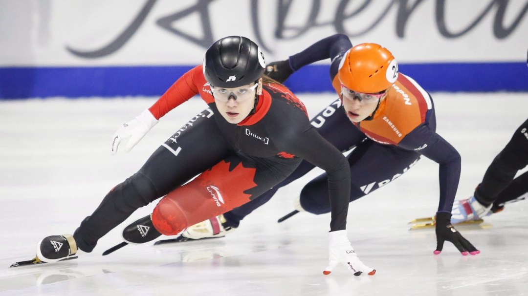 Short track speed skaters competing