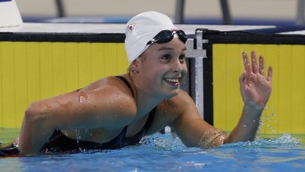 Swimmer waves from water by the wall