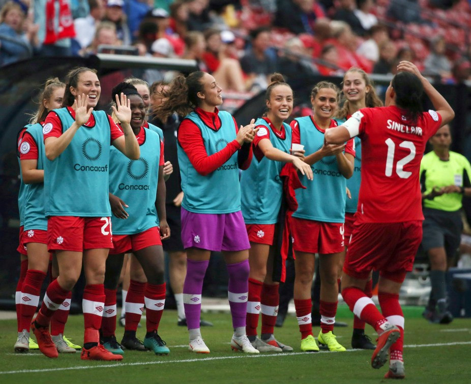 The Canada bench celebrates after forward Christine Sinclair (12) scored a goal against Panama during the second half of a soccer match at the CONCACAF women's World Cup qualifying tournament in Frisco, Texas, Sunday, Oct. 14, 2018. (AP Photo/Andy Jacobsohn)