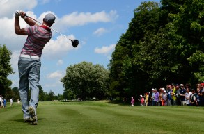 Golfer follows through on shot