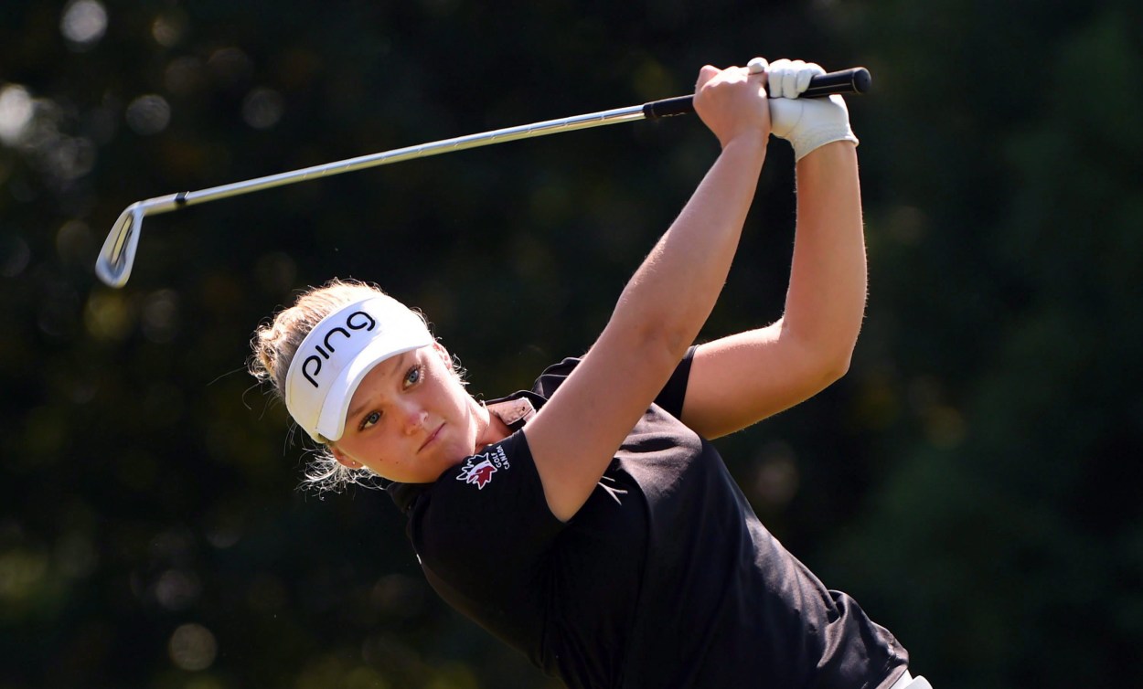 Brooke Henderson from waist up after a swing