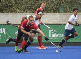 Taylor Curran of Canada battles for the ball