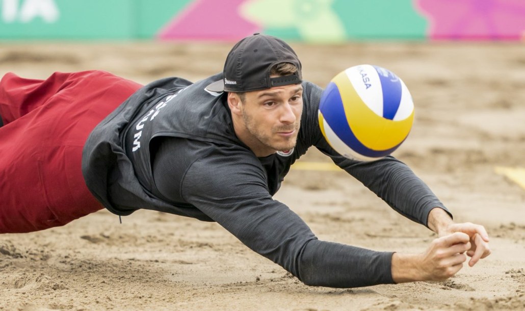 Aaron Nusbaum of Canada dives for the bal
