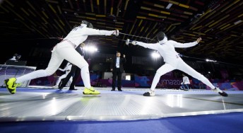 Shauna Biddulph, right, of Canada competes in womenÕs fencing