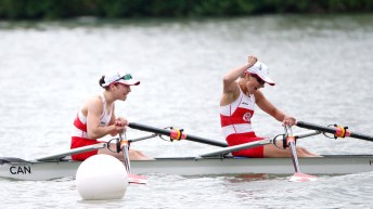 Rowers in boat celebrating