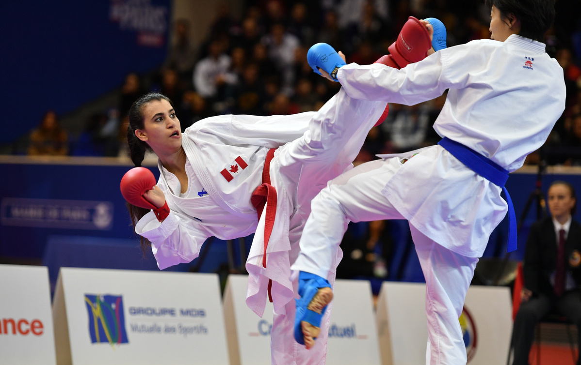 Canada's Haya Jumaa competes against an opponent from China