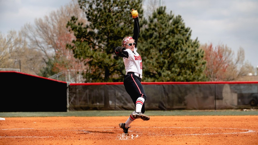 Morgan Rackel, on the mound, starts her pitching movement as she plays for the Austin Peays.