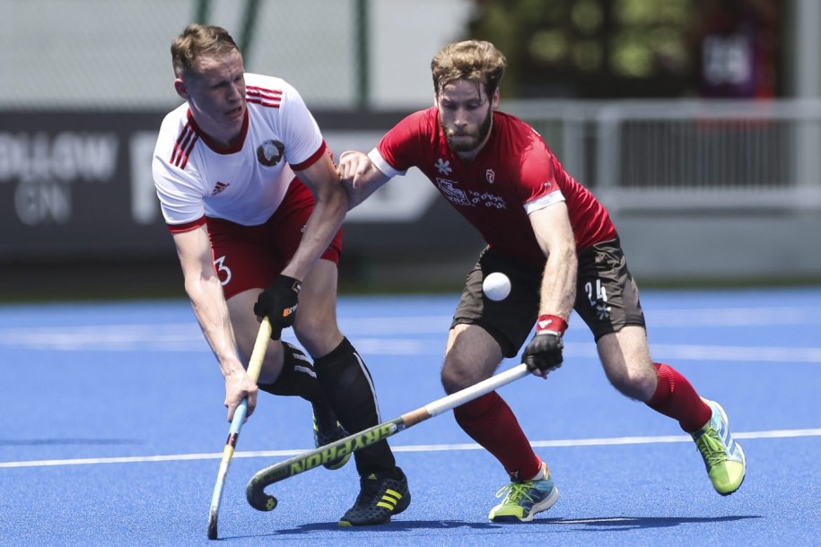 Kirkpatrick James of Canada, right, collides with Krysiuk Illia of Belarus while reaching balL