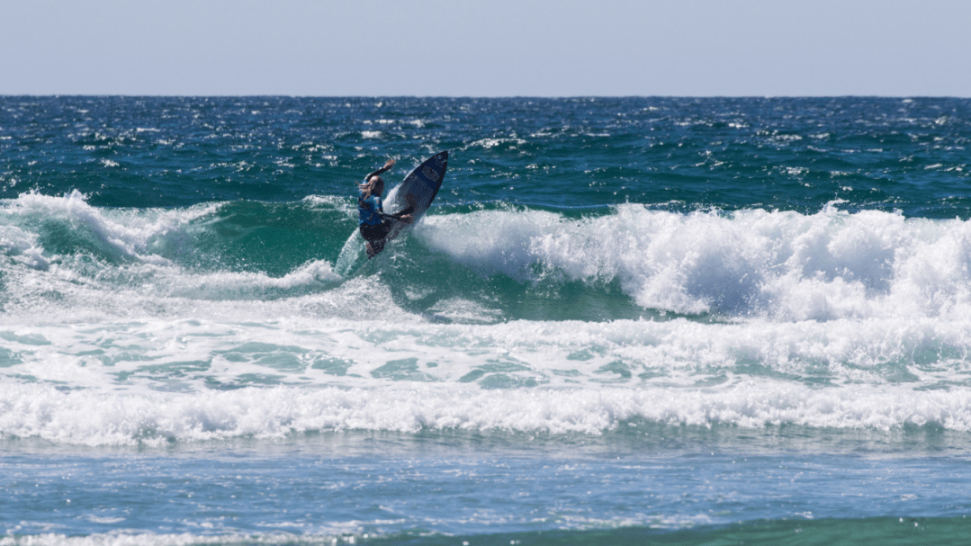 Surfer riding wave