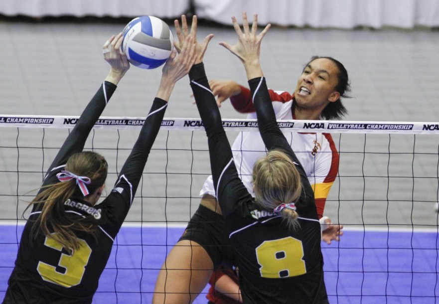 Alicia Ogoms spikes past two blockers