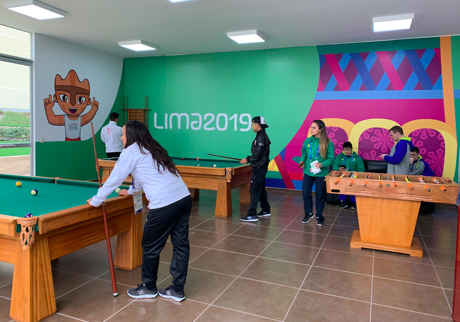 Athletes playing pool