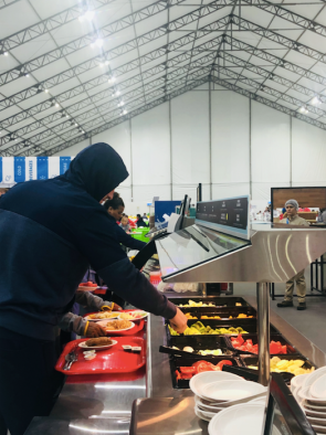 Athlete grabbing food from the buffet