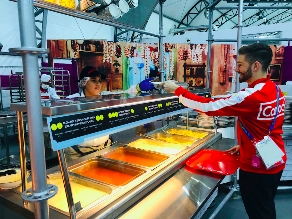 Team Canada athlete grabbing some food at the cafeteria