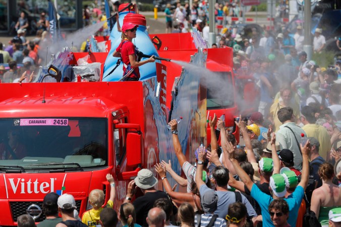 The publicity caravan sprays water on spectators