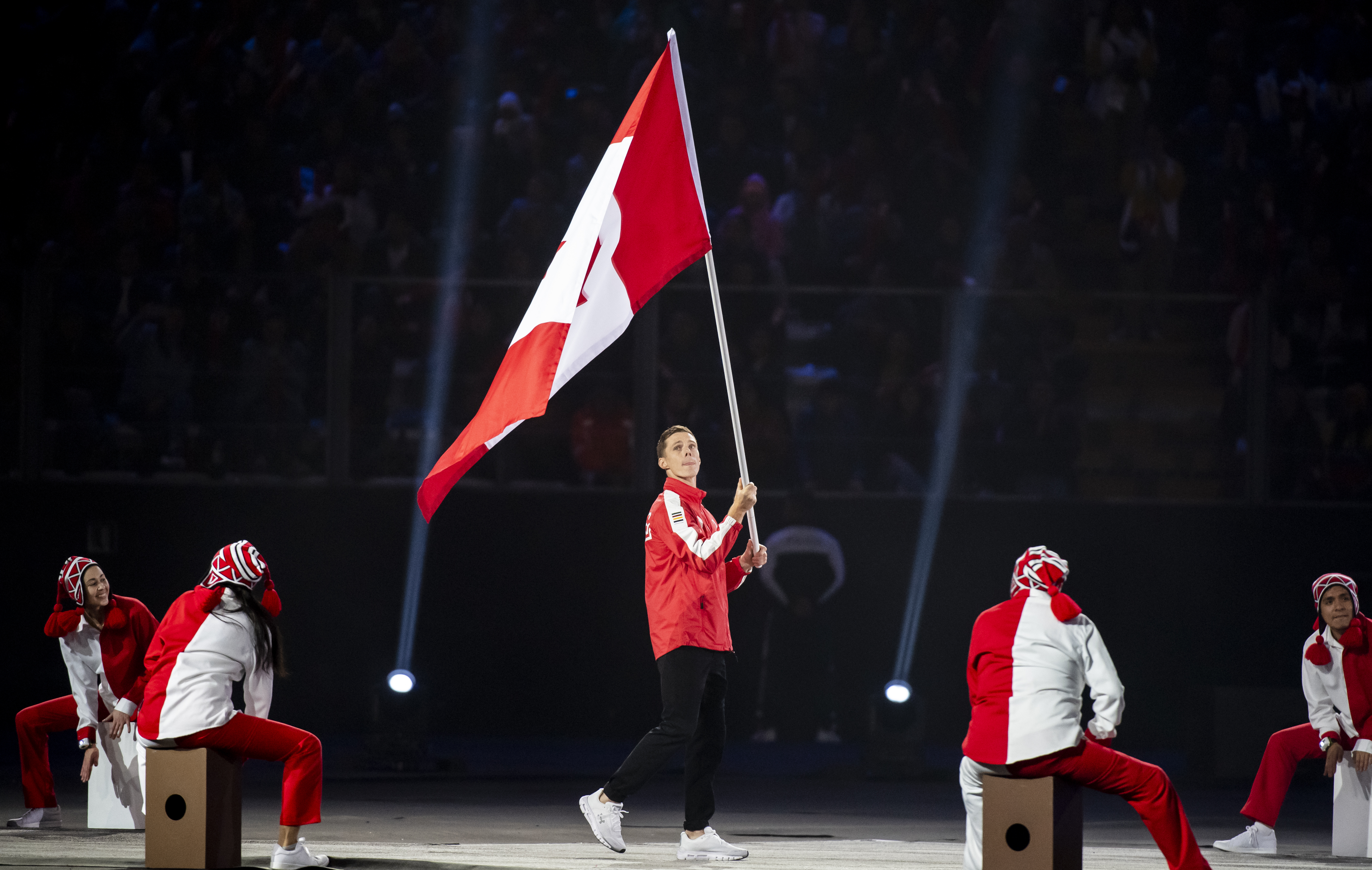 Scott Tupper, flag bearer for Team Canada, enters the Estadio Nacional to officially start the Lima 2019 Pan American Games